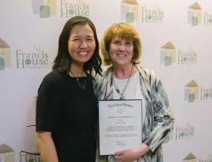 RC17 - St. Francis House Two women posing at a St. Francis House event; the woman on the right holds a certificate of recognition.