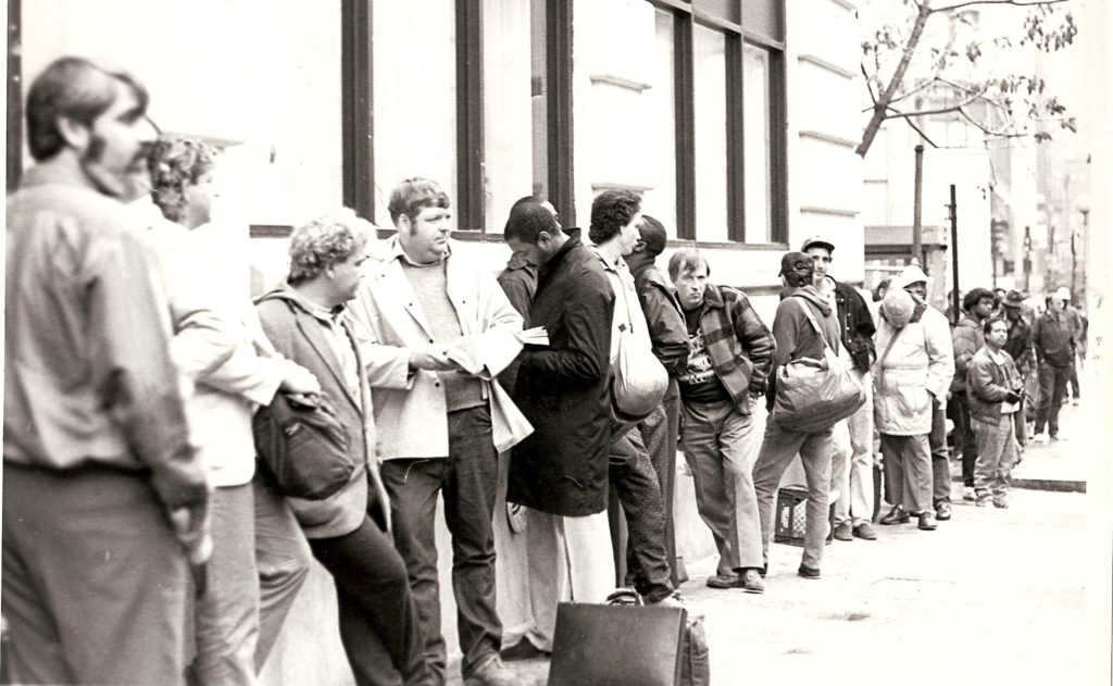 Guests line up, seeking lunch at St. Francis House in 1984, opening year.