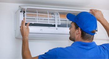 person-installing-air-conditioner